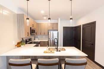 Quartz countertops with designer tile backsplash